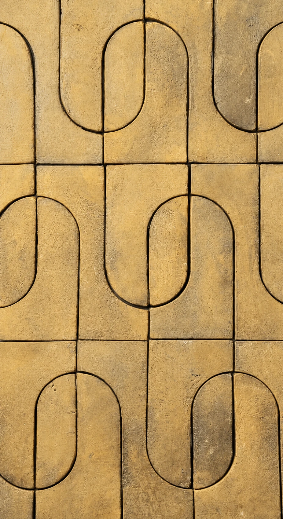 Illustration of textured gold decorative tiles with a continuous curved geometric pattern